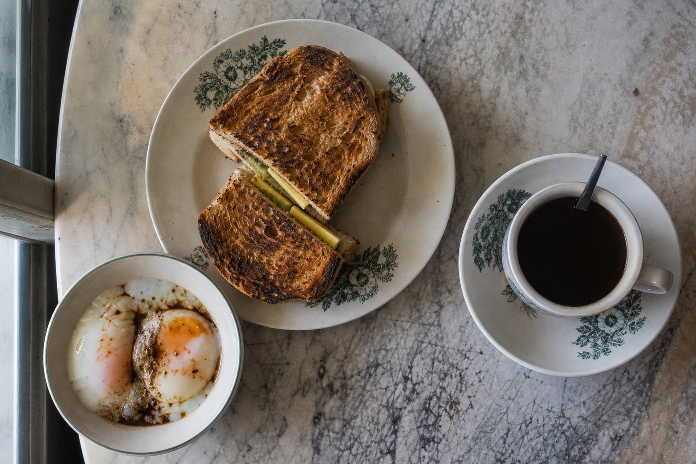 Kaya toast, soft-boiled eggs and a cup of kopi